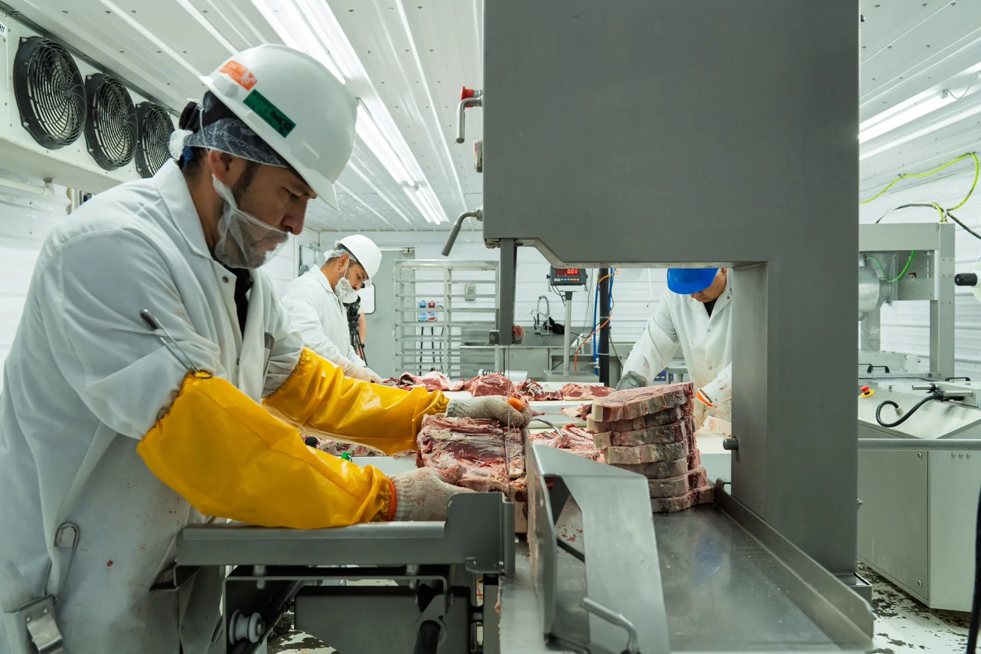Hat Creek Butchery crew processing beef at the saw
