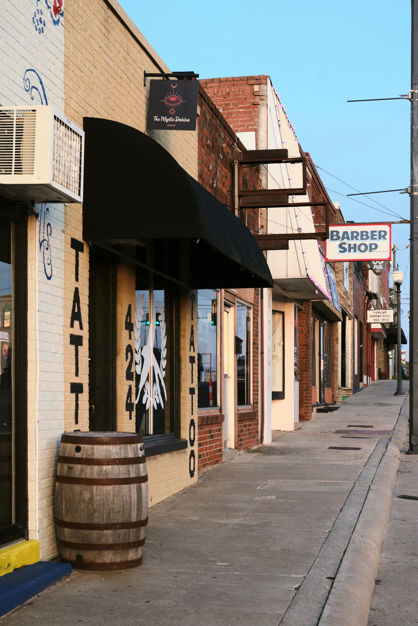 Row of Main Street storefronts including the barber shop in Yukon, Oklahoma