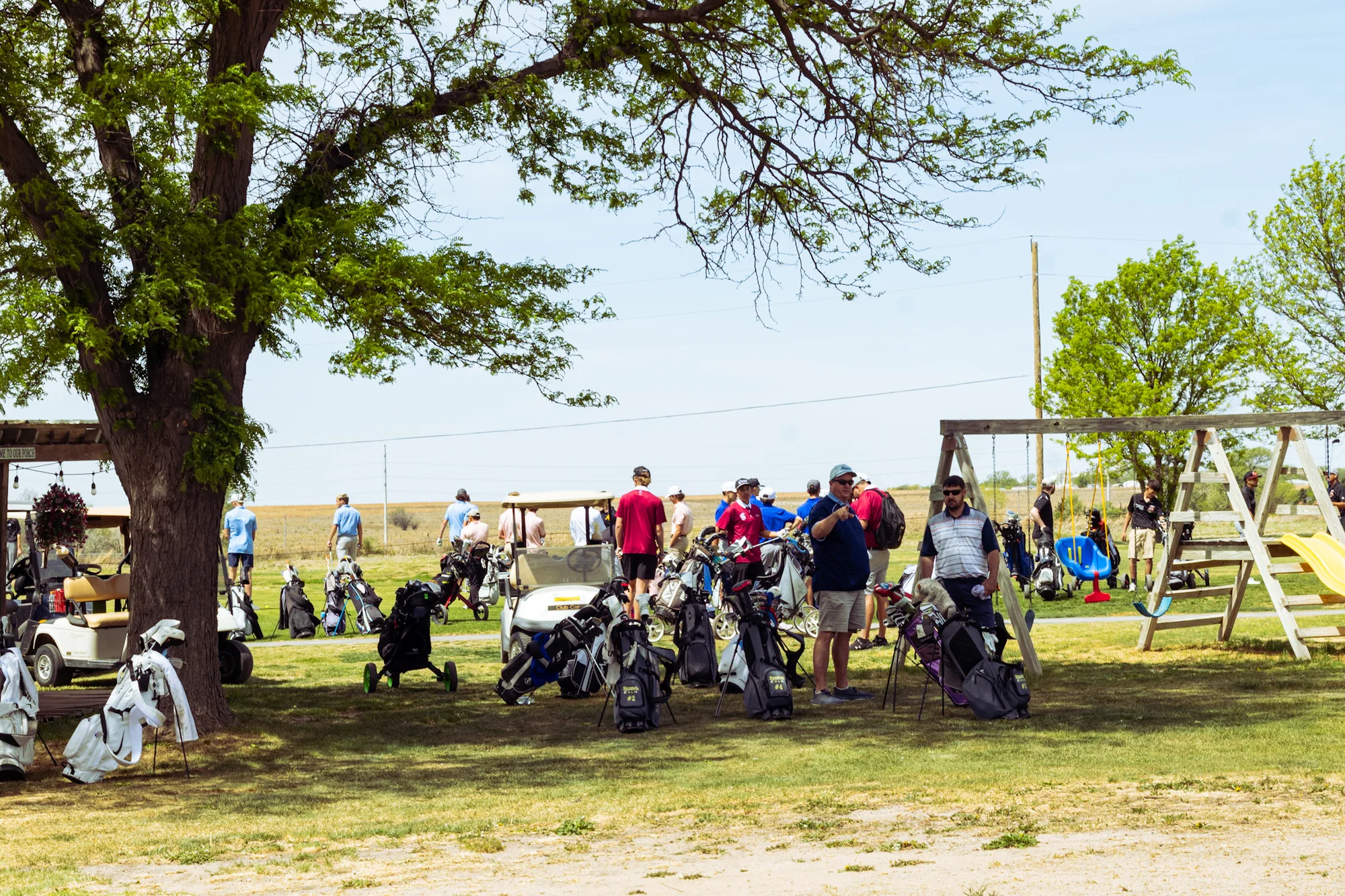 Tournament day crowd, carts and bags at Bentwood Golf Course