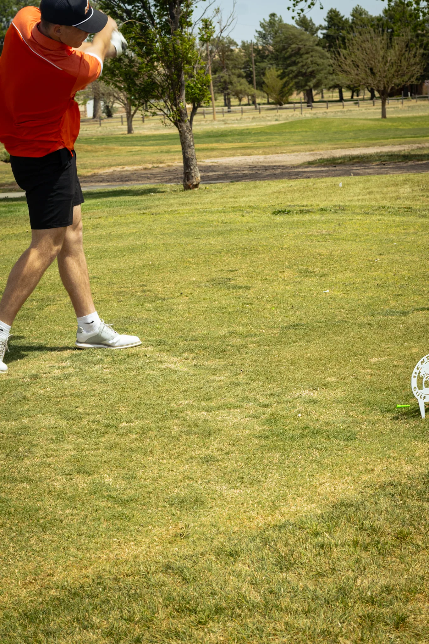 Close view of a golfer's follow-through at Bentwood Golf Course