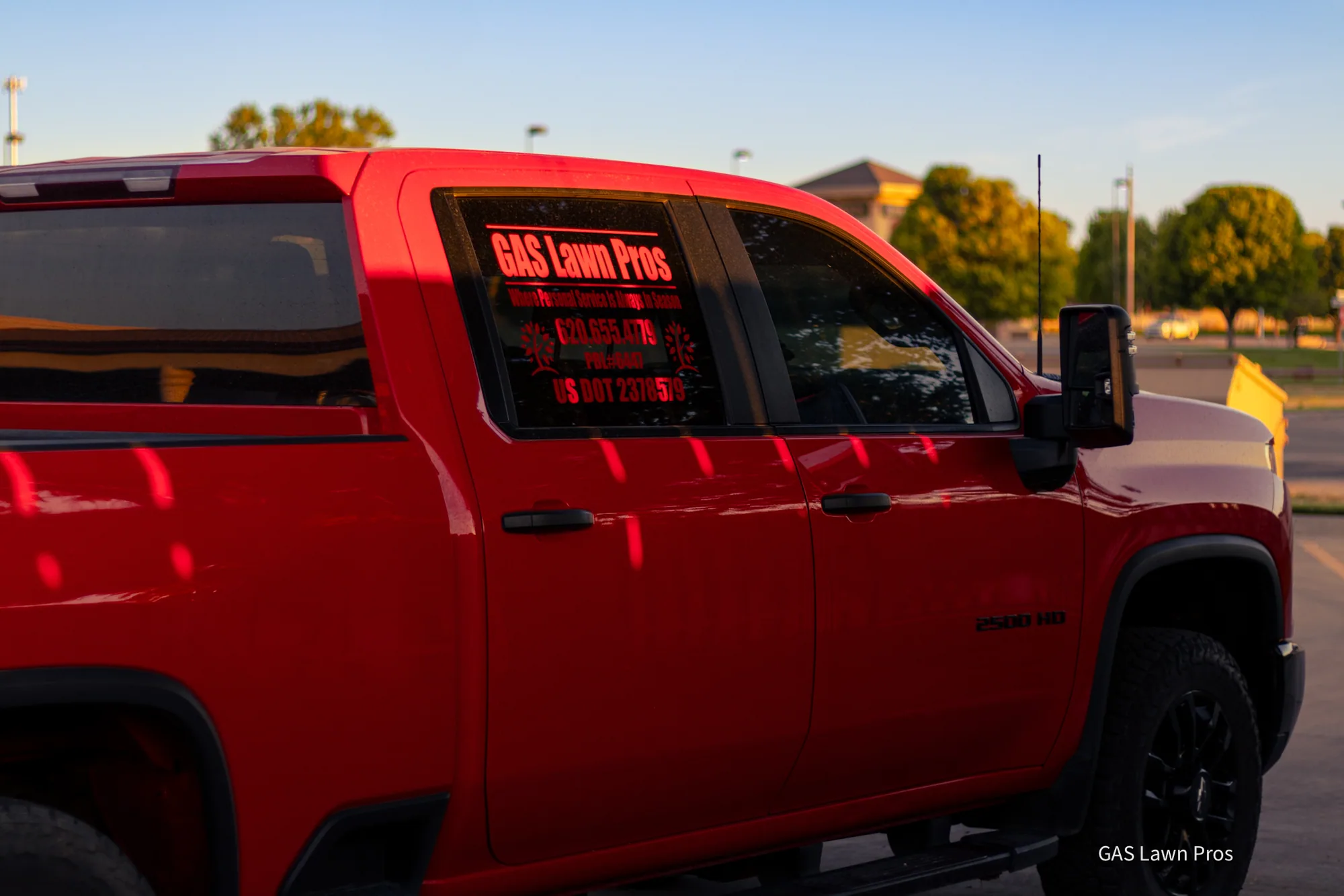 GAS Lawn Pros branded truck and trailer on a job site