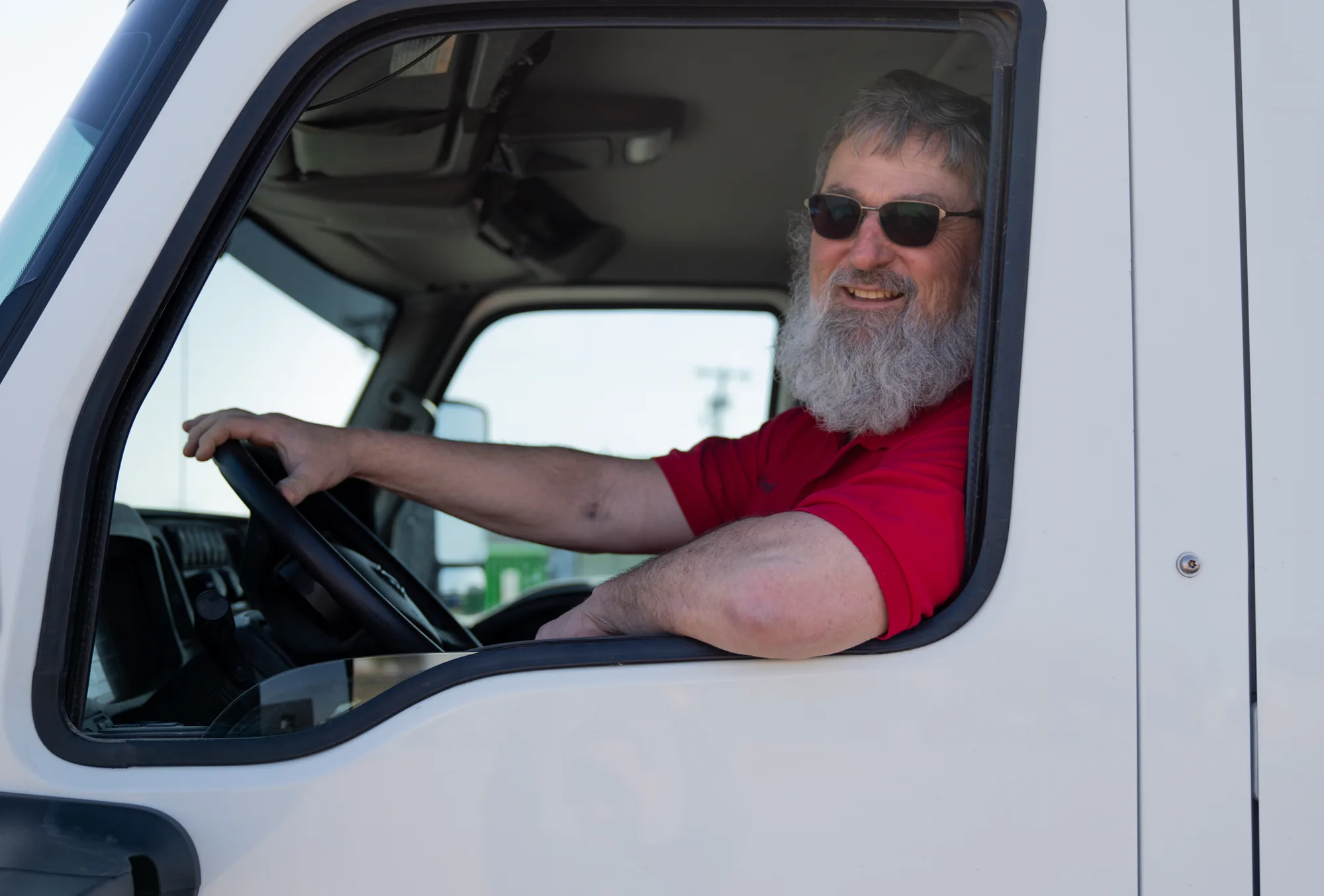 A J and J Services LLC driver at the wheel of a service truck