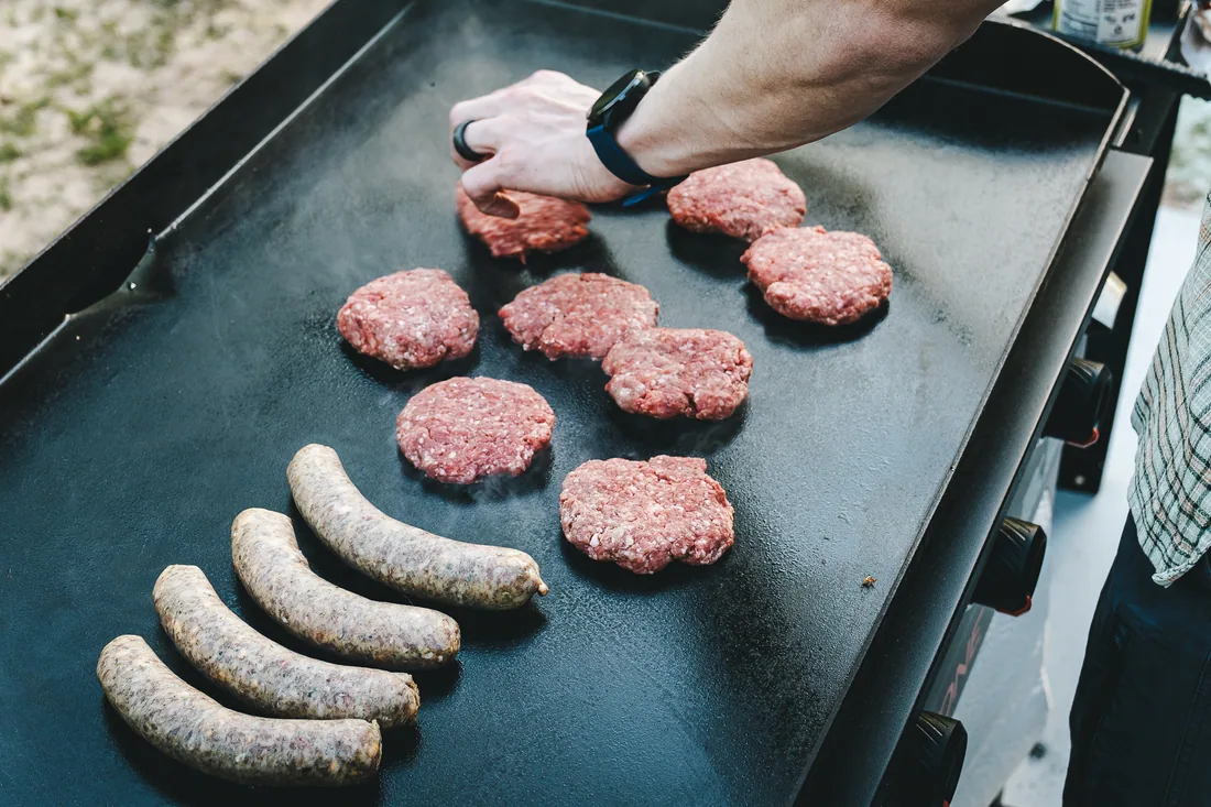A&K beef patties and bratwurst on the griddle