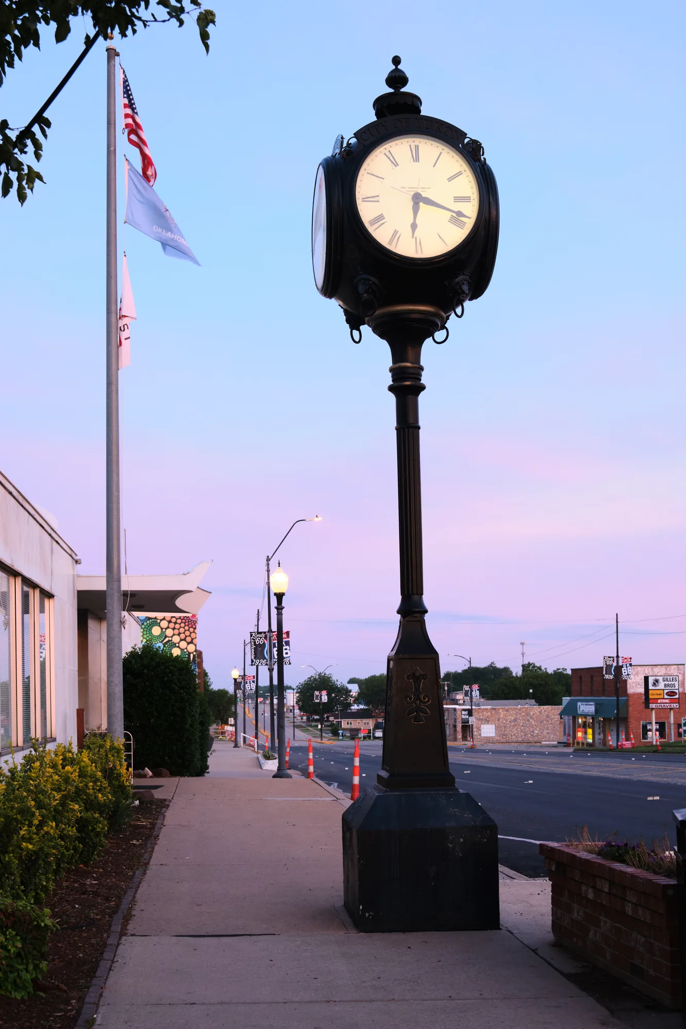 Main Street clock lit at dusk in Yukon, Oklahoma
