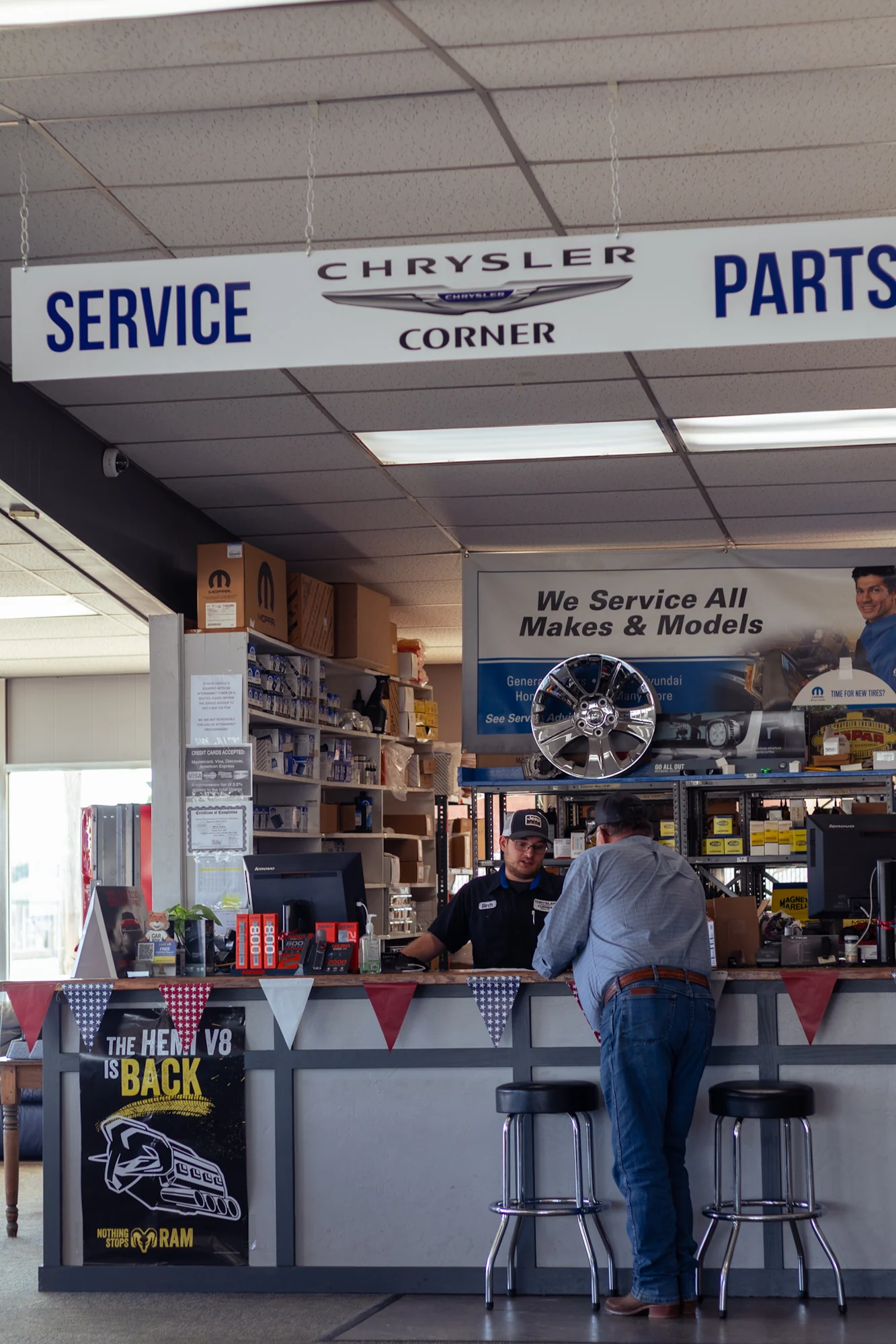 A customer at the Chrysler Corner service and parts counter